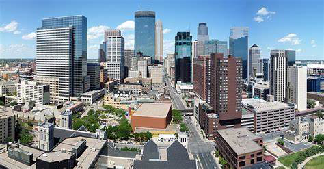 Wide angle view of the Minneapolis MN downtown during the day featuring many skyscrapers