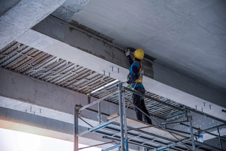 Man's,Hand,Plastering,A,Wall,With,Trowel.,Construction,Worker